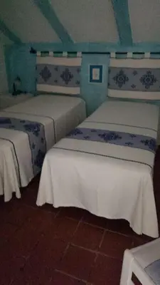 Letto o letti in una camera di Centro Servizi Marinella