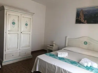 Letto o letti in una camera di Su Poeta
