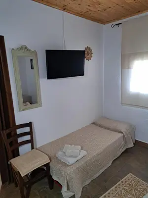 Letto o letti in una camera di Casa Toloi