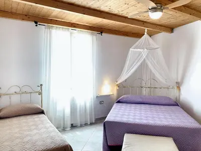 Letto o letti in una camera di Charming Apartment in Galtellì