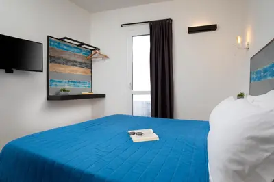 Letto o letti in una camera di OlbiaLoft