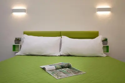 Letto o letti in una camera di OlbiaLoft