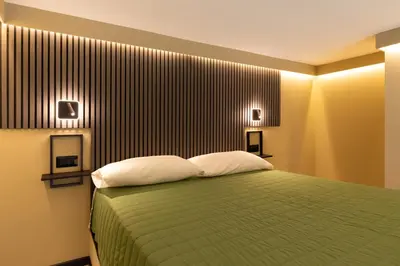 Letto o letti in una camera di OlbiaLoft
