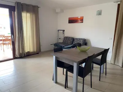 Area soggiorno di appartamento con terrazza in villetta