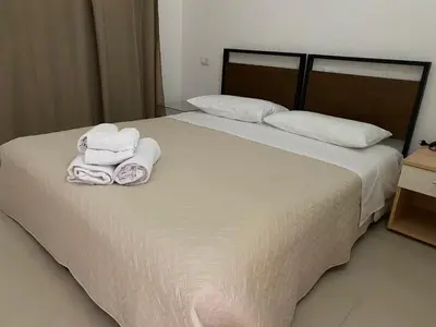 Letto o letti in una camera di appartamento con terrazza in villetta