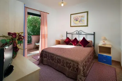Letto o letti in una camera di Appartamenti Le Ginestre e Gli Oleandri
