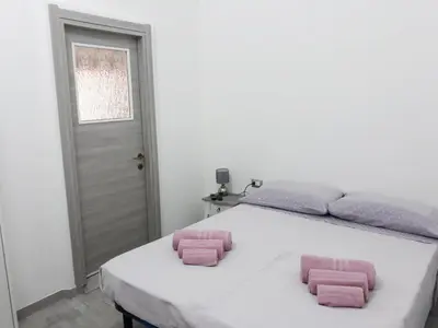Letto o letti in una camera di OLBIA CENTER VIA ROMA 22