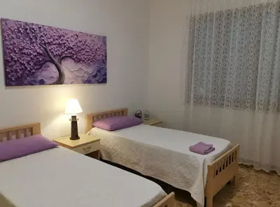 Letto o letti in una camera di App.Violet Sardegna Mare La Caletta
