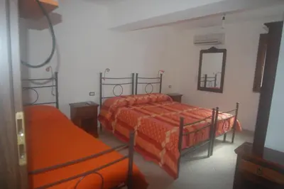 Letto o letti in una camera di Affittacamere Peonia