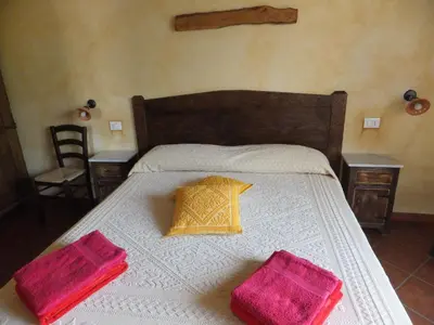 Letto o letti in una camera di Grazia Deledda