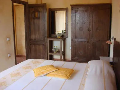 Letto o letti in una camera di Grazia Deledda