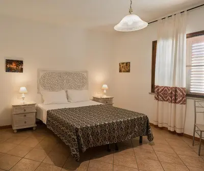 Letto o letti in una camera di B&B Il Corbezzolo