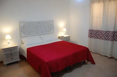 Letto o letti in una camera di B&B Il Corbezzolo