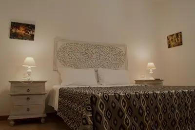 Letto o letti in una camera di B&B Il Corbezzolo
