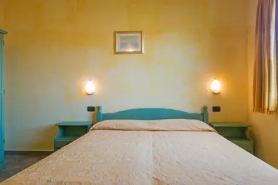 Letto o letti in una camera di Camere Magnolia