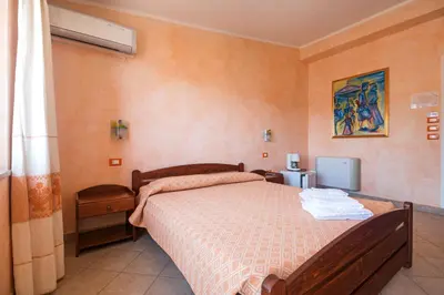 Letto o letti in una camera di Melalidone