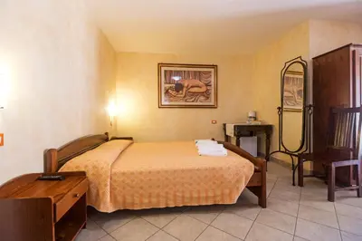 Letto o letti in una camera di Melalidone