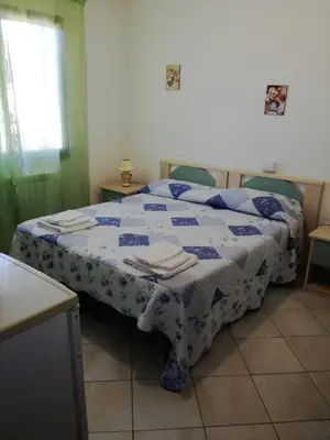 Letto o letti in una camera di B&B La Collina