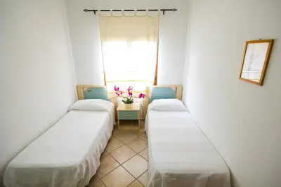 Letto o letti in una camera di Iris Houses