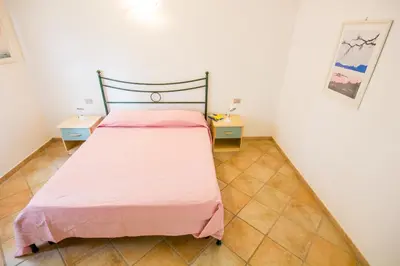 Letto o letti in una camera di Iris Houses