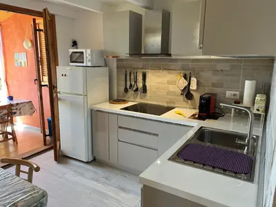 Cucina o angolo cottura di Porto Coda Cavallo Salina Bamba