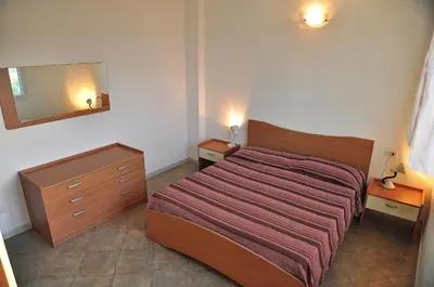 Letto o letti in una camera di Residenze Mare e Pineta
