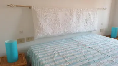 Letto o letti in una camera di Residenze Coda Cavallo