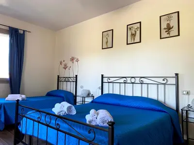 Letto o letti in una camera di Janas B&B