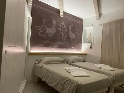 Letto o letti in una camera di Domus de Diana