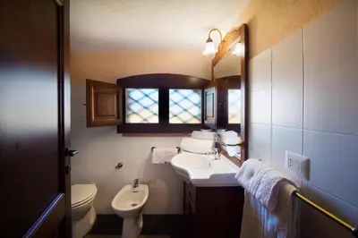 Letto o letti in una camera di Castello Malicas