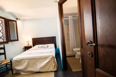 Letto o letti in una camera di Castello Malicas