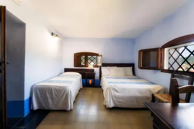 Letto o letti in una camera di Castello Malicas
