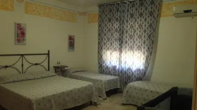 Letto o letti in una camera di Affittacamere il Laghetto