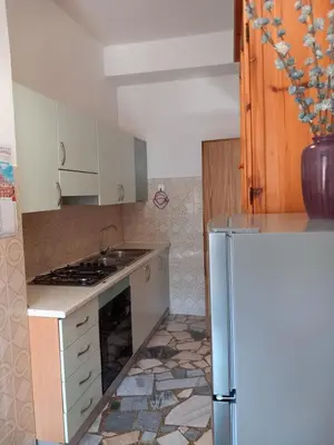 Cucina o angolo cottura di AFFITTACAMERE DORGALI B&B da ZIETTO
