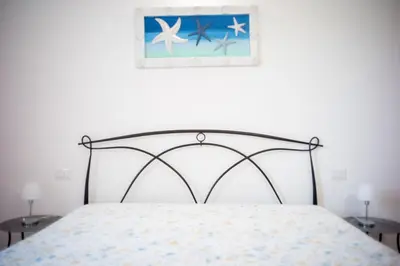 Letto o letti in una camera di Dimora Mare
