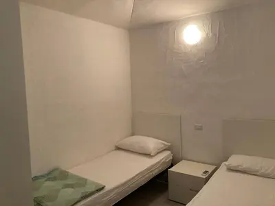 Letto o letti in una camera di Residenze Gambaru