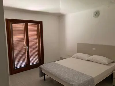 Letto o letti in una camera di Residenze Gambaru