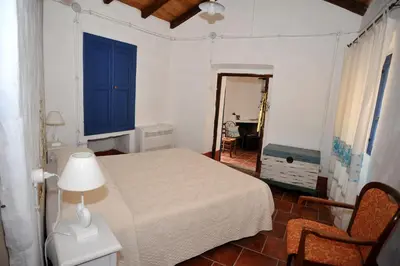 Letto o letti in una camera di B&B Corte San Lussorio