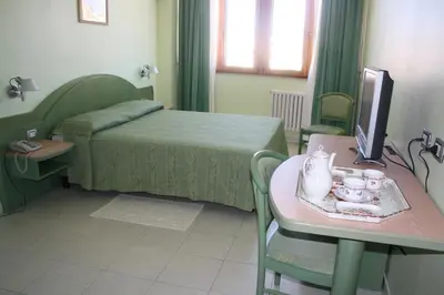 Letto o letti in una camera di Hotel Grillo
