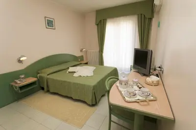 Letto o letti in una camera di Hotel Grillo