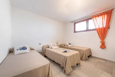 Letto o letti in una camera di Apartment in Cala Gonone 34714