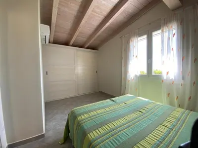 Letto o letti in una camera di Residence Il Borgo Del Mare - BUDONI SWEET HOME