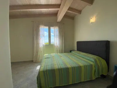 Letto o letti in una camera di Residence Il Borgo Del Mare - BUDONI SWEET HOME