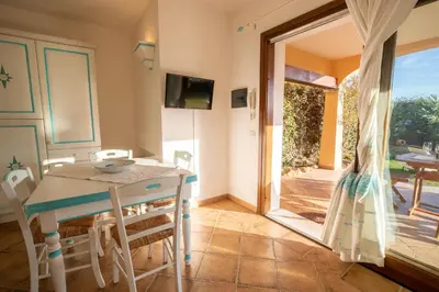 TV o dispositivi per l'intrattenimento presso Perseo case vacanze Poggio dei fiori con piscina privata