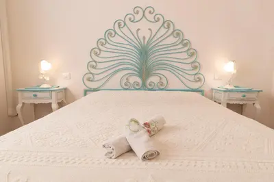 Letto o letti in una camera di Perseo case vacanze Poggio dei fiori con piscina privata
