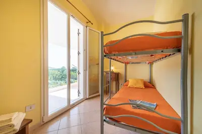 Letto o letti in una camera di Holiday home in Cala Gonone 34685