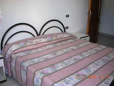 Letto o letti in una camera di Orosei-Sardegna-Appartamento 5 posti letto con giardino