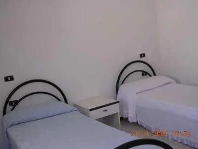 Letto o letti in una camera di Orosei-Sardegna-Appartamento 5 posti letto con giardino