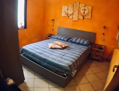 Letto o letti in una camera di Olivastro di Tanaunella
