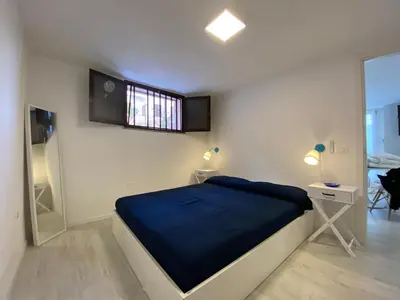 Letto o letti in una camera di BEACH HOUSE TANAUNELLA